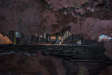 
NARROW GAUGE DIESEL RAILCAR - The interior of an old, rusty wreck of a passenger transport vehicle