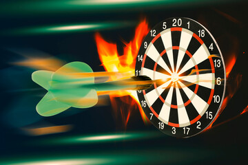 Dart flying into flaming target against black background, motion blur effect