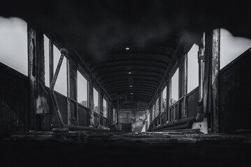 
NARROW GAUGE DIESEL RAILCAR - The interior of an old, rusty wreck of a passenger transport vehicle