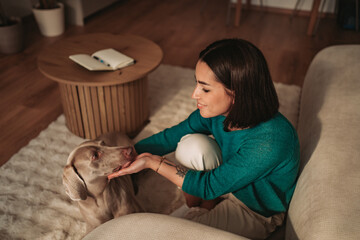 A Woman and Her Beloved Dog Enjoying a Cozy and Intimate Moment Together at Home