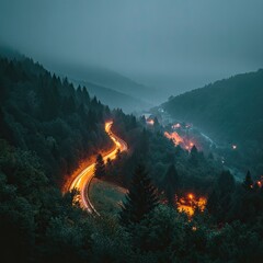 Winding road through misty mountains at night (1)