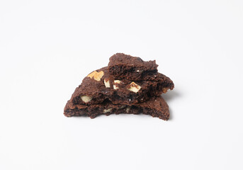 Slices of chocolate craft cookies on white background. Isolated
