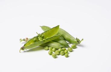 Pods of fresh green peas on a white background. Isolated