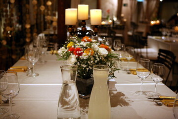 Festive Table Setting with Flowers and Candles