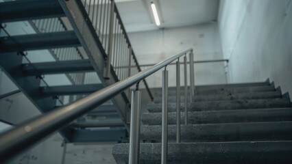 Naklejka premium Zoomed-in shot of stairs with steel balustrades