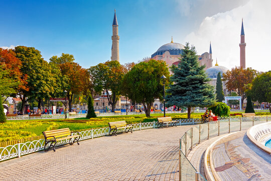 istanbul, turkiye - 18 aug, 2015: hagia sophia mosque view from sultan ahmet park. famous historic architecture building for religion travel. dome and minaret under blue sky with clouds - Powered by Adobe