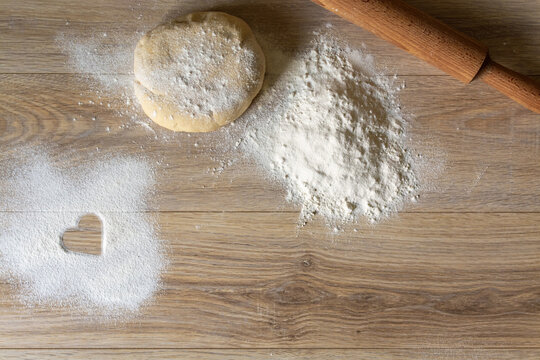 Homemade Baking Ingredients with Heart Symbol in Flour