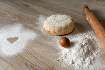 Homemade Baking Ingredients with Heart Symbol in Flour