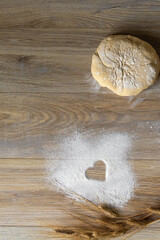 Homemade Baking Ingredients with Heart Symbol in Flour