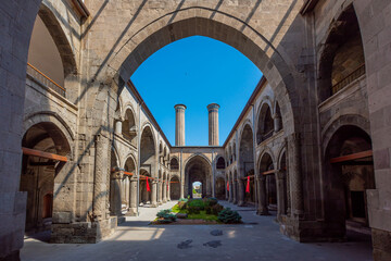 Obraz premium The double minaret located in the Erzurum province of Türkiye is a Seljuk work. The double minaret has become the symbol of Erzurum province.