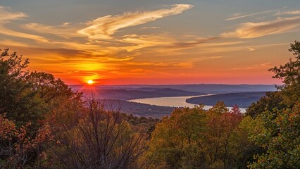 Sunset Colors Above a Natural Landscape with Trees and Mountains
