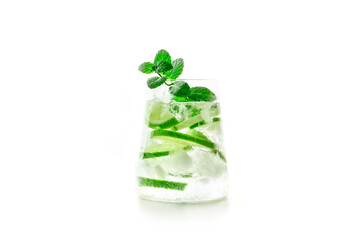 Lime lemonade, or limeade, in a glass with lime, mint, and plenty of ice, isolated on a white background. Mojito mocktail or cocktail