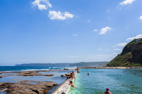 Merewether Beach ocean baths looking out to sea on sunlit summers day on Australian coast