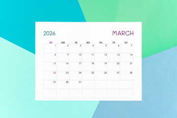 March calendar card for 2026 year on colorful background. Flat lay.