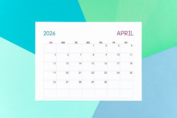April calendar card for 2026 year on colorful background. Flat lay.