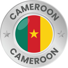 Cameroon flag in silver colored medal. National flag in metal circle emblem.
