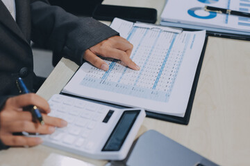 Entrepreneur Asian businessman and businesswoman discussing new business project in tablet in...