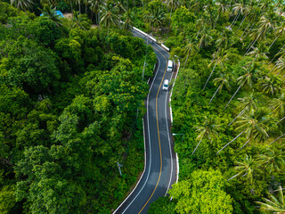 Aerial view asphalt road in tropical forest island
