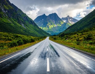 Fototapeta premium Wet Road Leading to Mountains in blur