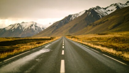 Wet Road Leading to Mountains in blur