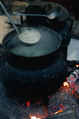 Grilled meat and sausages being served at a lively street festival during the Santos Populares celebration in Lisbon, Portugal. The traditional Portuguese food. Close up, soft focus. Part of a series