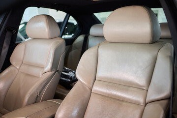 Indulge in Luxurious Orange Leather Car Seats that feature a Unique and Stylish Design