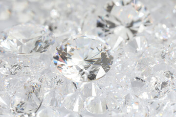 Many shiny diamonds on light background, closeup