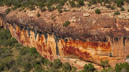 Wide-angle view of prehistoric petroglyphs set in a vast wilderness area