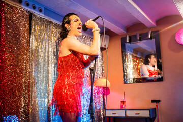 Singing Drag Queen Diva Captivating Audience With Powerful Performance in Vibrant Queer Venue