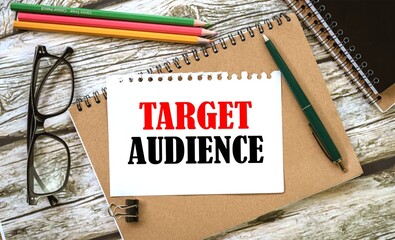 Target Audience. on a torn page from a notebook in a brown notebook. view from above.
