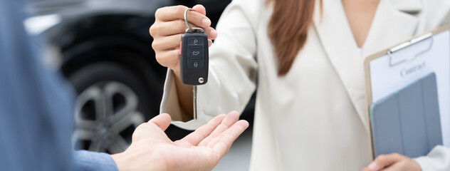 lease, rental car, sell, buy. Dealership manager send car keys to the new owner.  Sales, loan credit financial, rent vehicle, insurance,  renting, Seller, dealer, installment, car care business
