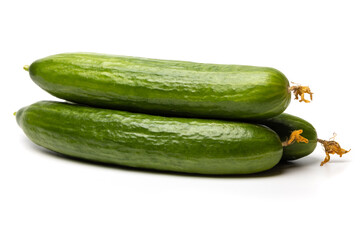 Photo of a small bunch of green natural organic cucumbers isolated on white background