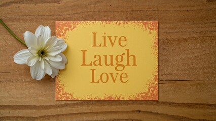 Inspirational message card adorned with blooming flowers on a bright yellow surface