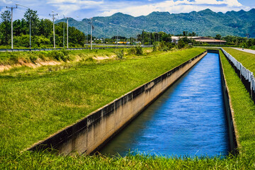 Irrigation canal or irrigation channel in concrete wall send water from the reservoir to...