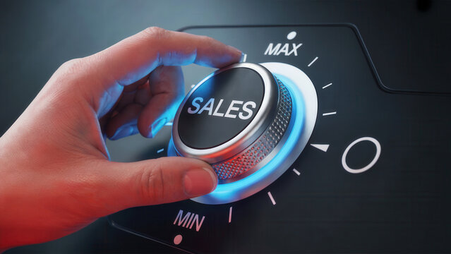 Hand turning a knob labeled SALES up towards MAX