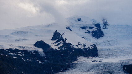Breathtaking views of Icelands glaciers and volcanic mountains. The stark contrasts of icy white...