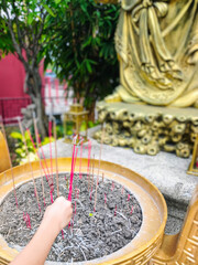 The placing of incense after prayers as a sign of respect for God. Visits to religious tourist sites.