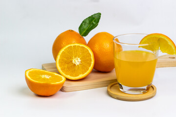 Fresh Oranges and Delicious Orange Juice on a Board