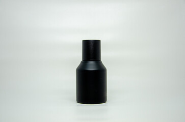 Sleek, matte black bottle with a matching cap. Ideal for luxury cosmetics, skincare, or minimalist...