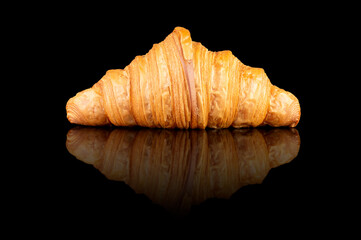 Croissant on Black Reflective Surface