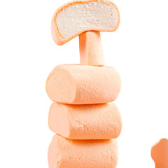 Stacked light orange confectionery pieces close up