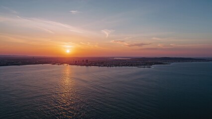 Fototapeta premium Dawn and dusk over a tranquil urban skyline