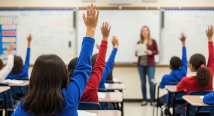 Students Raise Hands in Classroom Excited to Answer Teacher