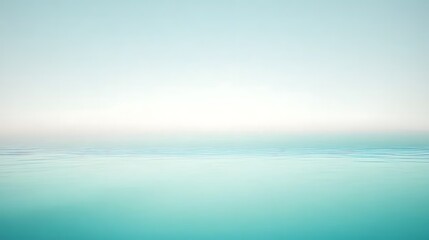 Obraz premium Serene turquoise ocean view with calm water and horizon creating a peaceful seascape