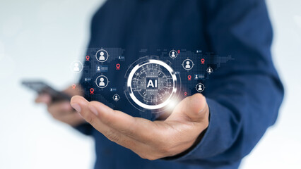 A businessman using AI technology to manage global human data, showing an artificial intelligence interface and digital network for business and recruitment strategy.
