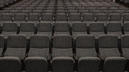 Fototapeta premium Gray padded seats organized in a performance venue