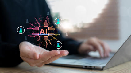 An artificial intelligence system selects target candidates for recruitment using digital technology and a data network. A business using AI on a laptop for HR strategy.