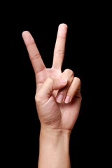 Peace Sign Hand Gesture on Black Background