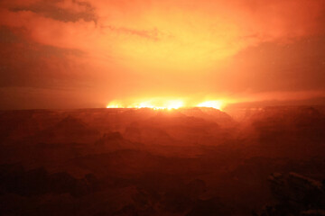Fiery-Red-Sunrise-Sky-With-Afterglow-Amid-Nature-and-Disaster-Tension
