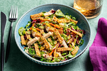 Fresh Vegetarian Salad Bowl with Fork and Knife